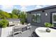 Relaxing rooftop deck featuring modern furniture and lush greenery at 1224 Alabama St, Indianapolis, IN 46202