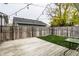 Private backyard with wooden deck and string lights at 2312 E Woodlawn Ave, Indianapolis, IN 46203