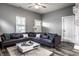 Spacious living room with sectional sofa and large windows at 2312 E Woodlawn Ave, Indianapolis, IN 46203