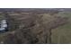 Aerial view of property with road, trees, and nearby buildings at 2750 N County Road 1000 E, Indianapolis, IN 46234