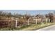 Farmland with wire fence and outbuildings; view from road at 2750 N County Road 1000 E, Indianapolis, IN 46234