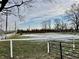 White post and rail fence surrounds a pasture at 2750 N County Road 1000 E, Indianapolis, IN 46234