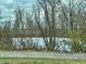 Pond surrounded by trees and a walking path at 2750 N County Road 1000 E, Indianapolis, IN 46234