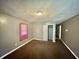 Grey bedroom with carpet, closet and window at 3209 Schofield Ave, Indianapolis, IN 46218