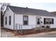 White house with black trim, gray roof, and a chain link fence at 3726 N Emerson Ne Ave, Indianapolis, IN 46218
