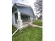 Gray house with a front porch and small yard at 4102 Spann Ave, Indianapolis, IN 46203