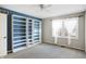 Bright bedroom with built-in shelving and carpet at 9464 Maple Way # 27, Indianapolis, IN 46268