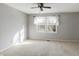 Bright bedroom featuring a ceiling fan and neutral decor at 9464 Maple Way # 27, Indianapolis, IN 46268
