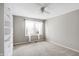 Spacious bedroom with ceiling fan and window at 9464 Maple Way # 27, Indianapolis, IN 46268