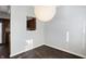Dining room with large light fixture and kitchen pass-through at 9464 Maple Way # 27, Indianapolis, IN 46268