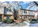 Brick front townhouse with green door, walkway, and landscaping at 9464 Maple Way # 27, Indianapolis, IN 46268