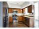 Updated kitchen featuring stainless steel appliances and wood cabinets at 9464 Maple Way # 27, Indianapolis, IN 46268