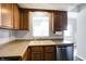 Kitchen features a double sink and stainless steel dishwasher at 9464 Maple Way # 27, Indianapolis, IN 46268