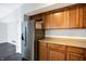 Kitchen with wood cabinets and stainless steel appliances at 9464 Maple Way # 27, Indianapolis, IN 46268