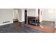 Living room with fireplace and dark floors at 9464 Maple Way # 27, Indianapolis, IN 46268