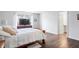 Main bedroom with wood bed frame and en-suite bathroom at 10178 Brushfield Ln, Fishers, IN 46037