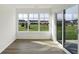 Sunroom featuring large windows and access to backyard at 122 Maxim Ct, Cumberland, IN 46229