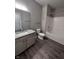 Bathroom with granite vanity and tiled shower/tub combo at 12938 University Cres # Apt 2B, Carmel, IN 46032