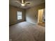 Spacious bedroom with neutral carpeting and large window at 12938 University Cres # Apt 2B, Carmel, IN 46032
