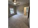 Spacious bedroom with neutral carpeting and large window at 12938 University Cres # Apt 2B, Carmel, IN 46032