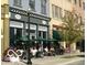 Vibrant streetscape with outdoor seating and local businesses at 12938 University Cres # Apt 2B, Carmel, IN 46032