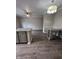 Dining area with hardwood floors and kitchen island at 12938 University Cres # Apt 2B, Carmel, IN 46032