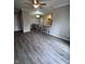 Open concept dining area with grey plank flooring at 12938 University Cres # Apt 2B, Carmel, IN 46032