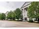 Street view of Harvard House, showcasing its architectural style and landscaping at 12938 University Cres # Apt 2B, Carmel, IN 46032
