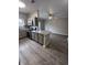 Open concept kitchen with granite countertops and stainless steel appliances at 12938 University Cres # Apt 2B, Carmel, IN 46032