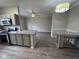 Modern kitchen with granite countertops and stainless steel appliances at 12938 University Cres # Apt 2B, Carmel, IN 46032