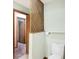 Partially shown bathroom with toilet and wooden lattice partition at 13832 W Old Nashville Rd, Columbus, IN 47201