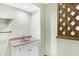 Small bathroom with vanity, sink, and storage at 13832 W Old Nashville Rd, Columbus, IN 47201