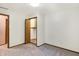 Simple bedroom with neutral walls, carpet flooring, and built-in closet at 13832 W Old Nashville Rd, Columbus, IN 47201