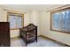 bedroom with crib, dresser, and two windows at 13832 W Old Nashville Rd, Columbus, IN 47201