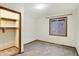 Spacious bedroom with neutral walls, carpeting, and a large closet at 13832 W Old Nashville Rd, Columbus, IN 47201