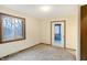 Bedroom with sliding door to deck and window at 13832 W Old Nashville Rd, Columbus, IN 47201