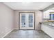Dining area with French doors leading to the outdoors and tile flooring at 13832 W Old Nashville Rd, Columbus, IN 47201