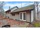 Rear view of house, showing patio and double doors at 13832 W Old Nashville Rd, Columbus, IN 47201