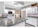 White kitchen cabinets, granite countertops and stainless steel appliances at 13832 W Old Nashville Rd, Columbus, IN 47201