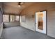Screened porch with ceiling fan and access to interior at 13832 W Old Nashville Rd, Columbus, IN 47201