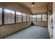 Spacious screened porch with ceiling fan and wooded views at 13832 W Old Nashville Rd, Columbus, IN 47201