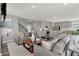 Open living room showcasing a neutral color palette, plush sofas, and a modern coffee table at 1445 Stonehaven Dr, Westfield, IN 46074