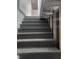 Dark grey wooden stairs leading to basement at 1826 N Dexter St, Indianapolis, IN 46202