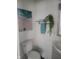 Clean bathroom with beach-themed art and a gray vanity at 1826 N Dexter St, Indianapolis, IN 46202