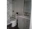 Updated bathroom with grey vanity and bathtub at 1826 N Dexter St, Indianapolis, IN 46202