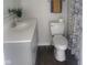 Modern bathroom with gray vanity, toilet, and shower at 1826 N Dexter St, Indianapolis, IN 46202