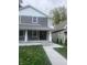Two-story gray house with white accents, a front porch, and walkway at 1826 N Dexter St, Indianapolis, IN 46202