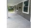 Spacious front porch with concrete flooring and white columns at 1826 N Dexter St, Indianapolis, IN 46202
