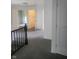 Hallway with grey carpet, leading to bedrooms at 1826 N Dexter St, Indianapolis, IN 46202