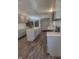 Modern kitchen with gray cabinets, island, stainless steel appliances, and vinyl flooring at 1826 N Dexter St, Indianapolis, IN 46202